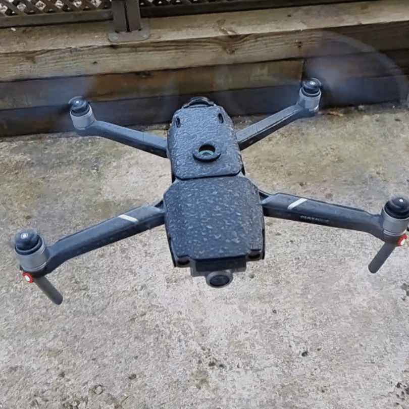 drone sprayed with water 13 11zon